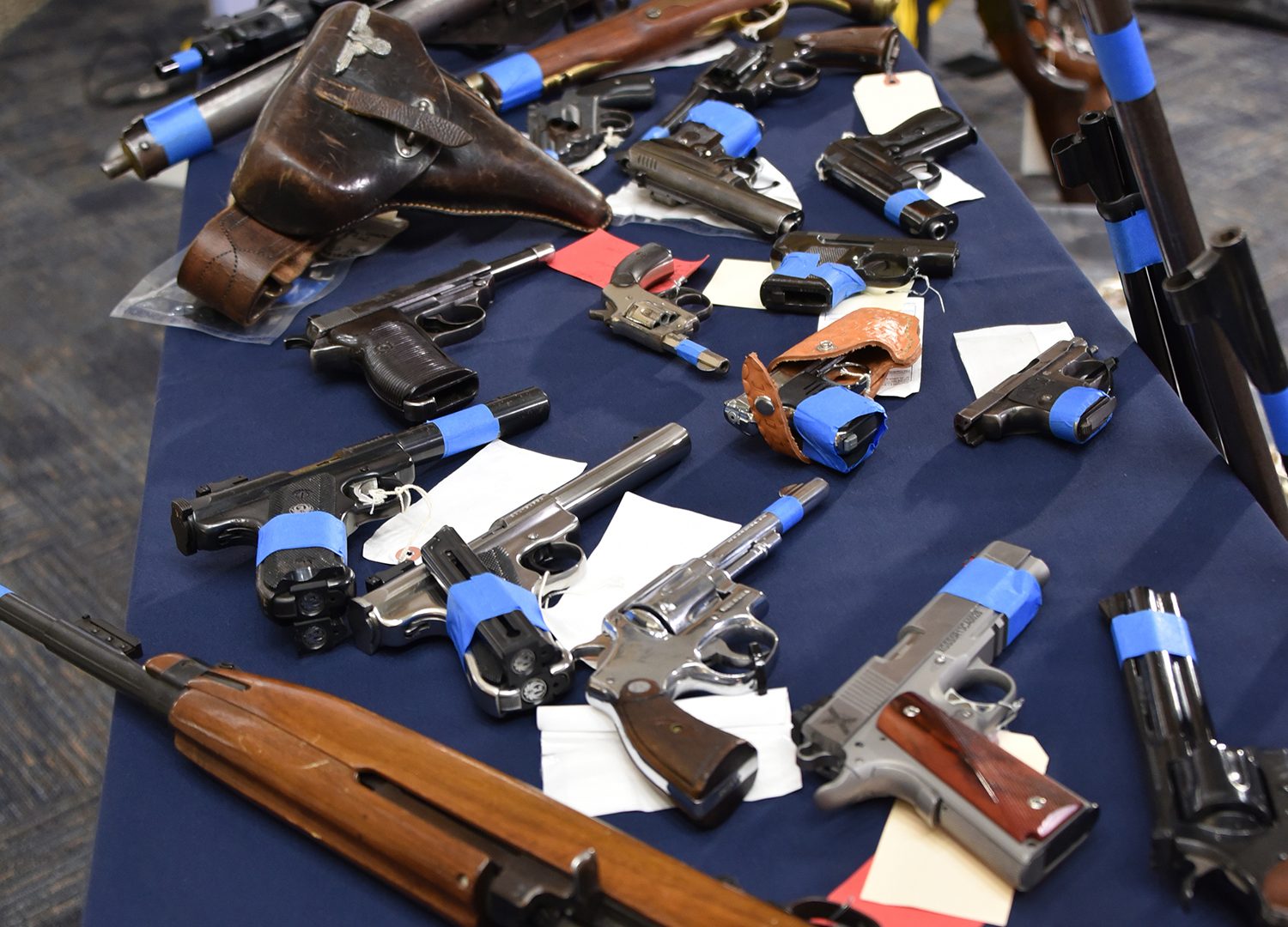 Police display firearms turned in during July 2018 gun amnesty (RCMP)